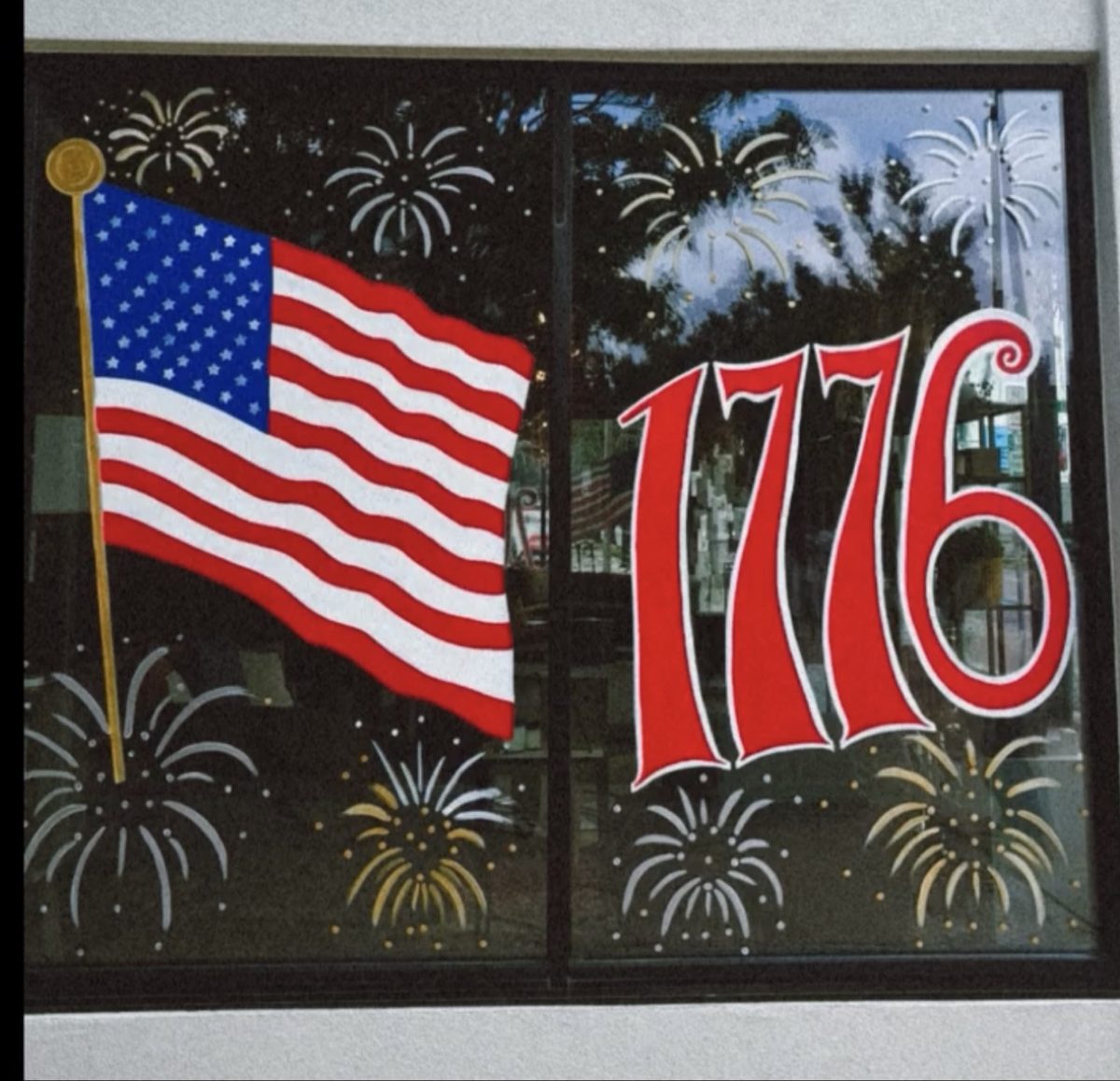 1776 window painting with American flag and fireworks