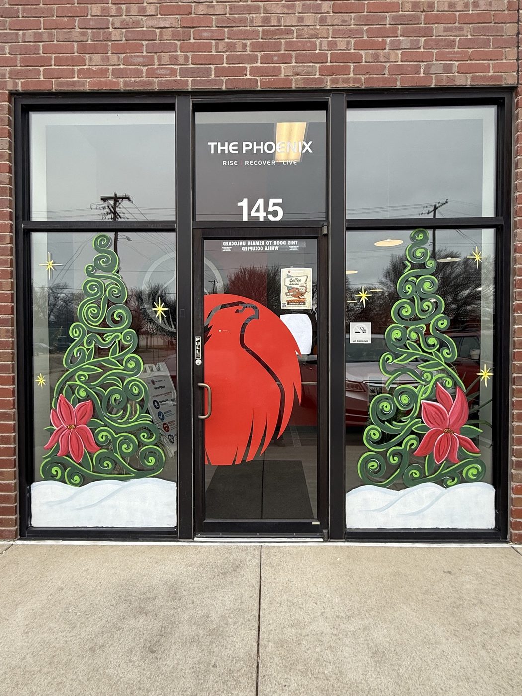 Christmas tree window paintings at The Phoenix entrance