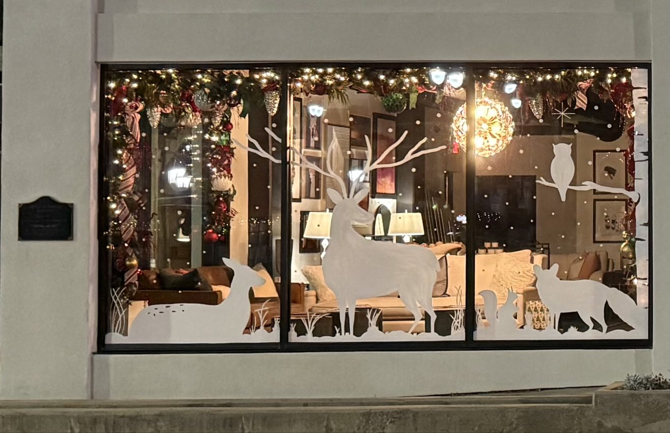 Woodland animals window painting glowing at night